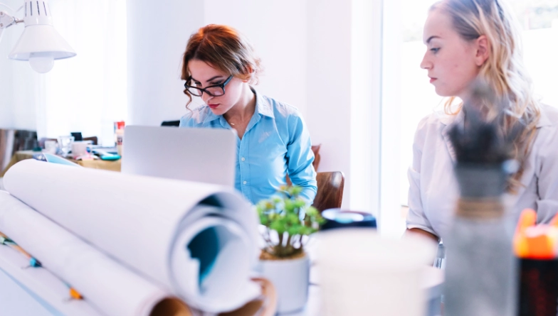 Print experts reviewing business collateral